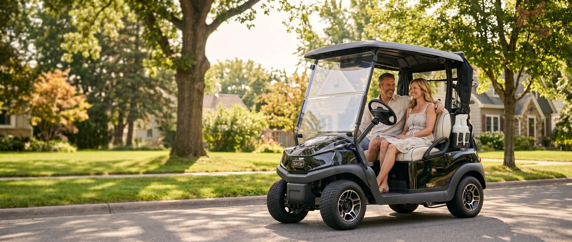 Couple cruising a Minnesota neighborhood in a Club Car Tempo golf cart