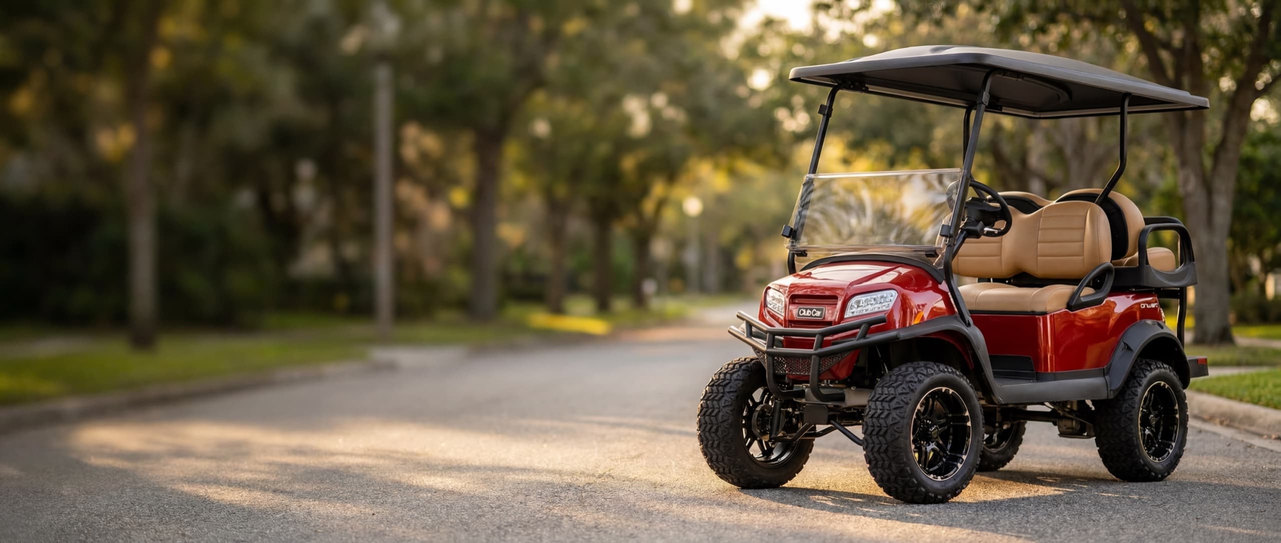 A lineup of new and pre-owned Club Car golf carts on the showroom floor at MOR Golf and Utility